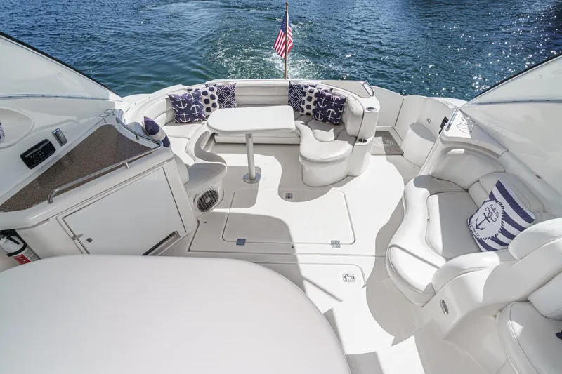 Slide: The Image of Luxurious 2004 Cruisers Yachts 540 Express interior with elegant seating and nautical decor. - 13