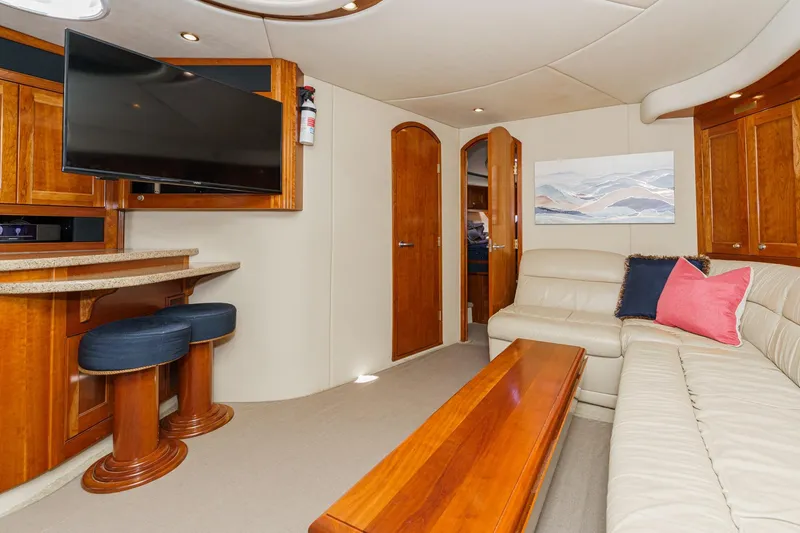 Slide: The Image of Luxurious 2004 Cruisers Yachts 540 Express interior with leather seating and modern amenities. - 35