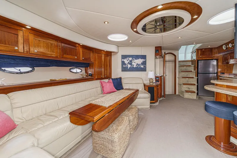 Slide: The Image of Luxurious interior of 2004 Cruisers Yachts 540 Express with elegant wood and leather furnishings. - 37