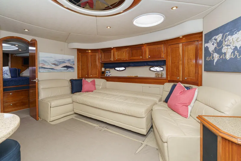 Slide: The Image of Luxurious 2004 Cruisers Yachts 540 Express interior with leather seating and elegant wood cabinetry. - 44
