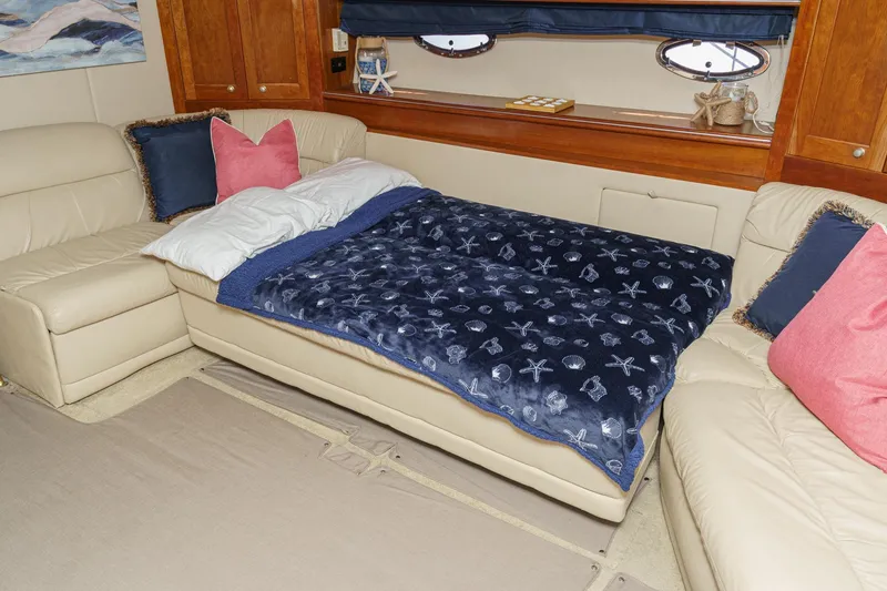 Slide: The Image of Luxurious 2004 Cruisers Yachts 540 Express interior with cozy bed and elegant decor. - 47