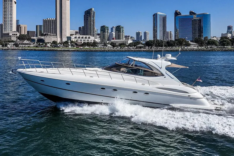 Slide: The Image of 2004 Cruisers Yachts 540 Express cruising near city skyline on a sunny day. - 5