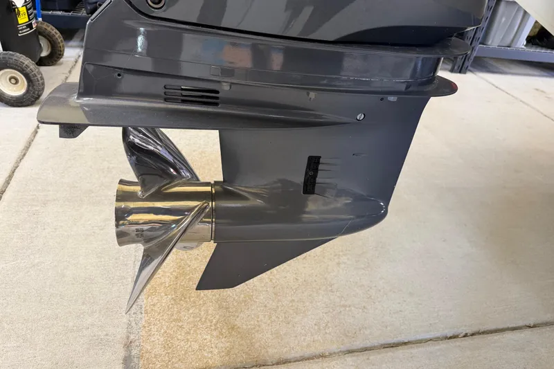 Slide: The Image of 2022 Parker 2501 Center Console boat propeller and lower unit on concrete surface. - 14