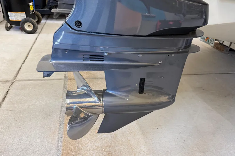 Slide: The Image of Outboard motor of a 2022 Parker 2501 Center Console boat, showing propeller detail. - 16