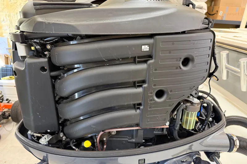 Slide: The Image of 2022 Parker 2501 Center Console boat engine, detailed view of components and design. - 24