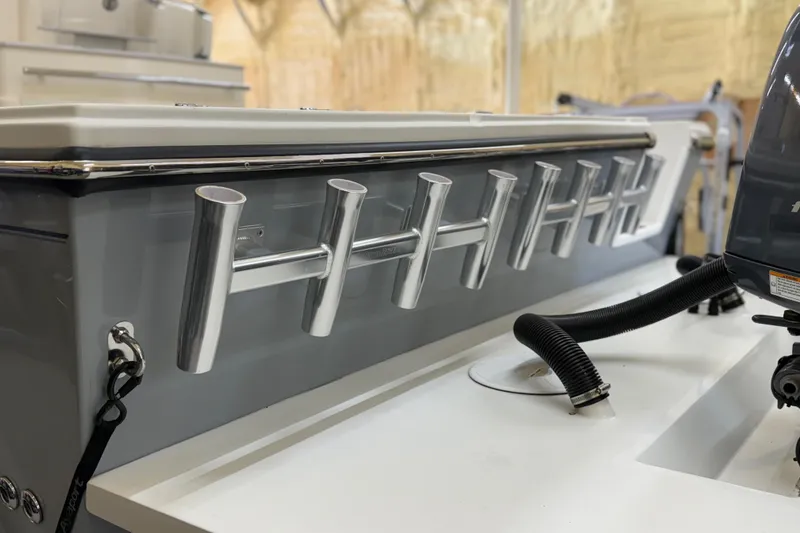 Slide: The Image of 2022 Parker 2501 Center Console boat with rod holders and engine details. - 28