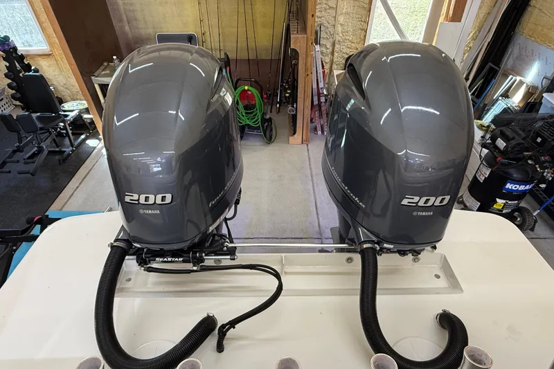 Slide: The Image of Twin Yamaha 200 outboard engines on a 2022 Parker 2501 Center Console boat. - 32