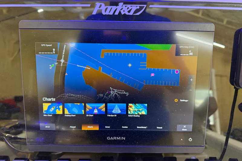 Slide: The Image of Garmin navigation display on 2022 Parker 2501 Center Console boat, showing charts and settings. - 61
