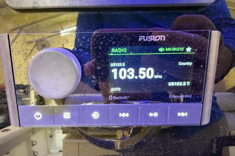 Slide: The Image of Fusion MS-RA210 radio display on 2022 Parker 2501 Center Console boat. - 62