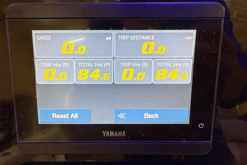 Slide: The Image of Yamaha display on 2022 Parker 2501 Center Console showing trip and fuel data. - 64