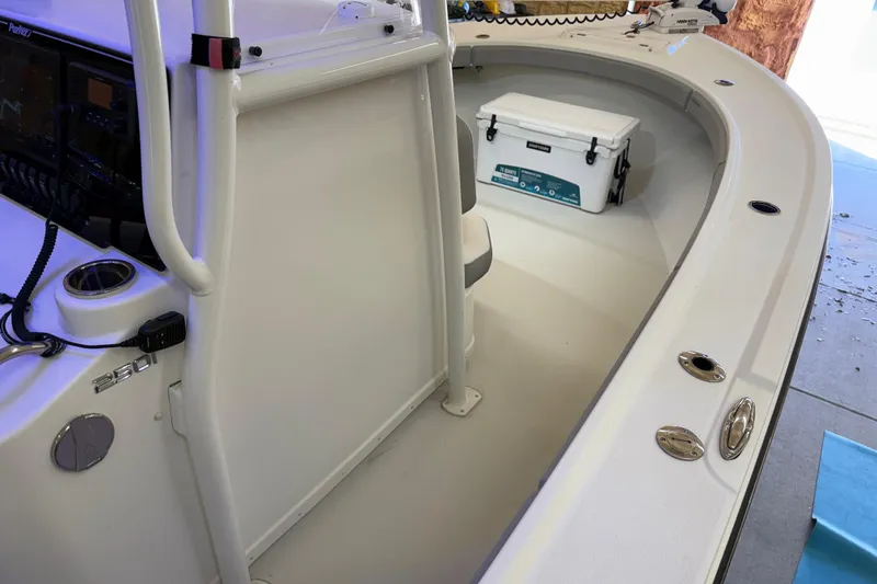 Slide: The Image of 2022 Parker 2501 Center Console boat interior with seating and storage. - 75