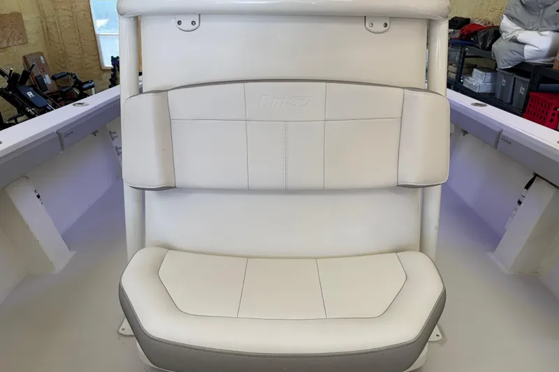 Slide: The Image of 2022 Parker 2501 Center Console boat seat, white upholstery, in a garage setting. - 78