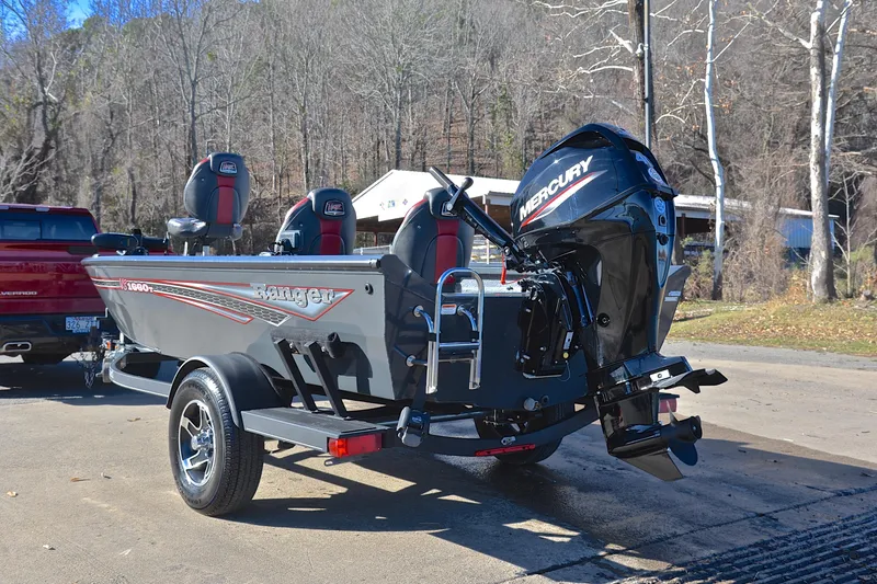 Slide: The Image of 2021 Ranger VS1660 T boat with Mercury engine on trailer in outdoor setting. - 12