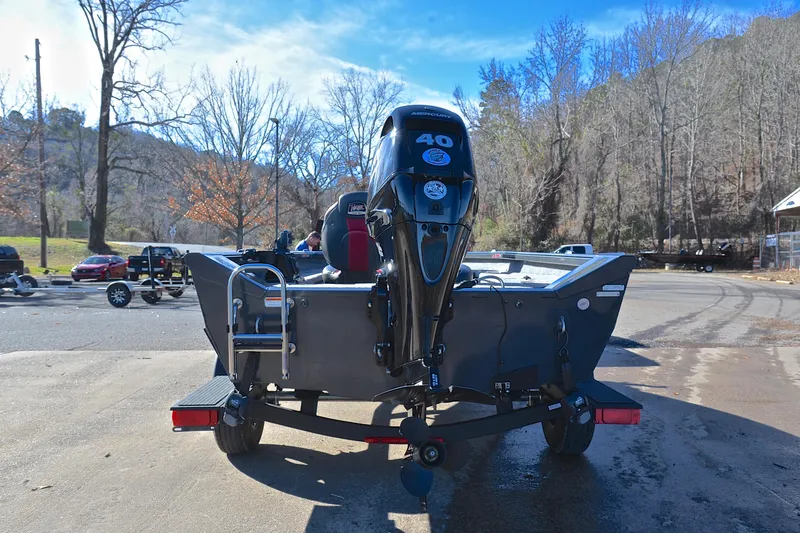 Slide: The Image of 2021 Ranger VS1660 T boat with Mercury 40 engine, parked outdoors on a sunny day. - 13