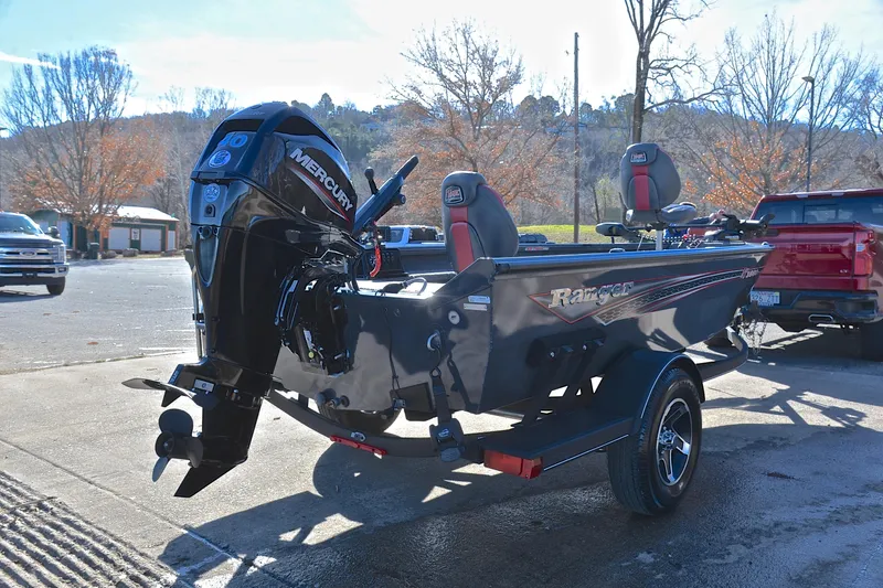 Slide: The Image of 2021 Ranger VS1660 T boat with Mercury engine on trailer in sunny outdoor setting. - 14