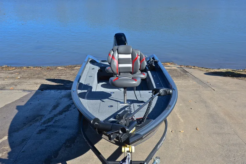 Slide: The Image of 2021 Ranger VS1660 T fishing boat on a concrete ramp by the water. - 17