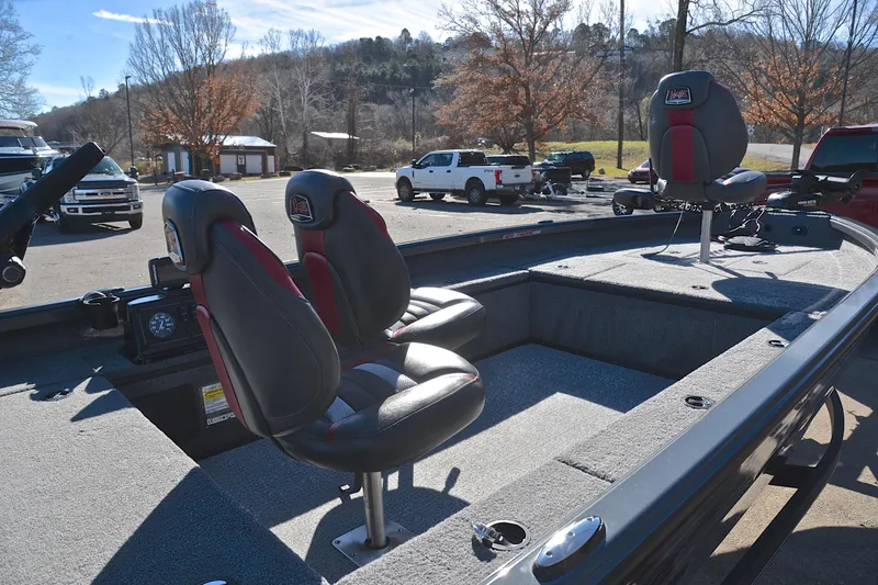 Slide: The Image of 2021 Ranger VS1660 T boat interior with two seats, parked outdoors. - 19