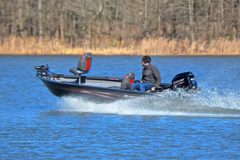 Slide: The Image of 2021 Ranger VS1660 T boat speeding on a lake with a Mercury engine. - 4