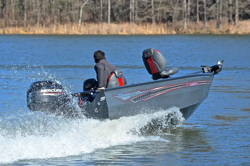Slide: The Image of 2021 Ranger VS1660 T boat cruising on a lake with Mercury outboard motor. - 6