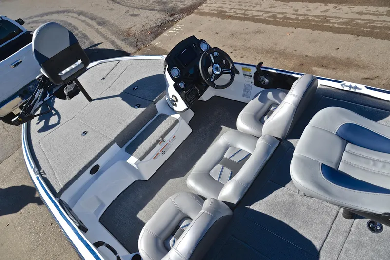 Slide: The Image of 2018 Nitro Z17 boat interior with gray seating and steering console. - 21