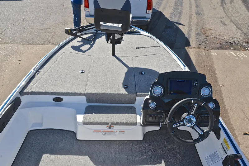 Slide: The Image of 2018 Nitro Z17 boat interior with steering wheel and dashboard controls. - 24