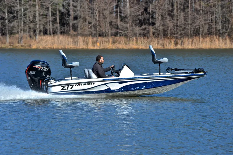 Slide: The Image of 2018 Nitro Z17 boat cruising on a lake with a Mercury Pro XS engine. - 3