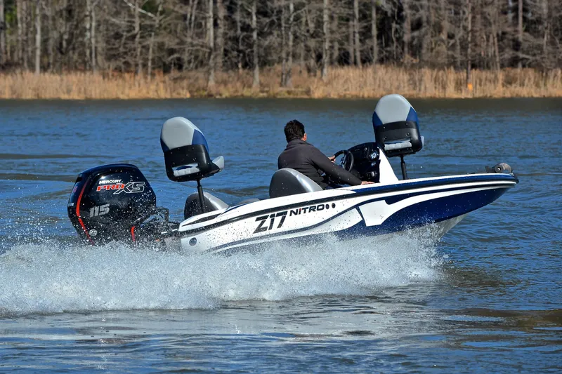Slide: The Image of 2018 Nitro Z17 boat speeding on a lake with Mercury Pro XS engine. - 5