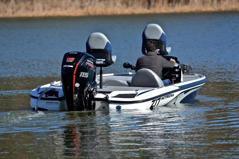 Slide: The Image of 2018 Nitro Z17 boat with Mercury 115 Pro XS engine on a calm lake. - 8