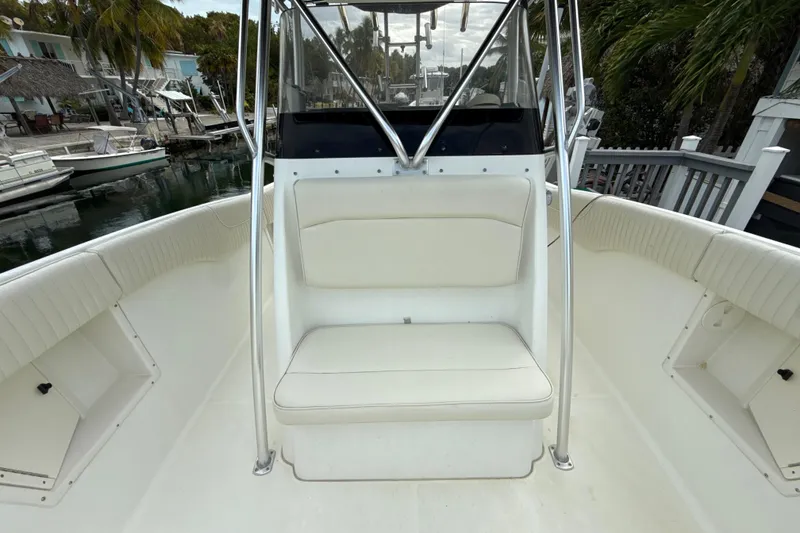 Slide: The Image of 2003 Hydra-Sports Vector 2800 CC boat interior with white seating and railing. - 11