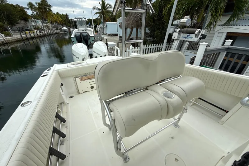 Slide: The Image of 2003 Hydra-Sports Vector 2800 CC boat interior with seating and twin Mercury engines. - 9