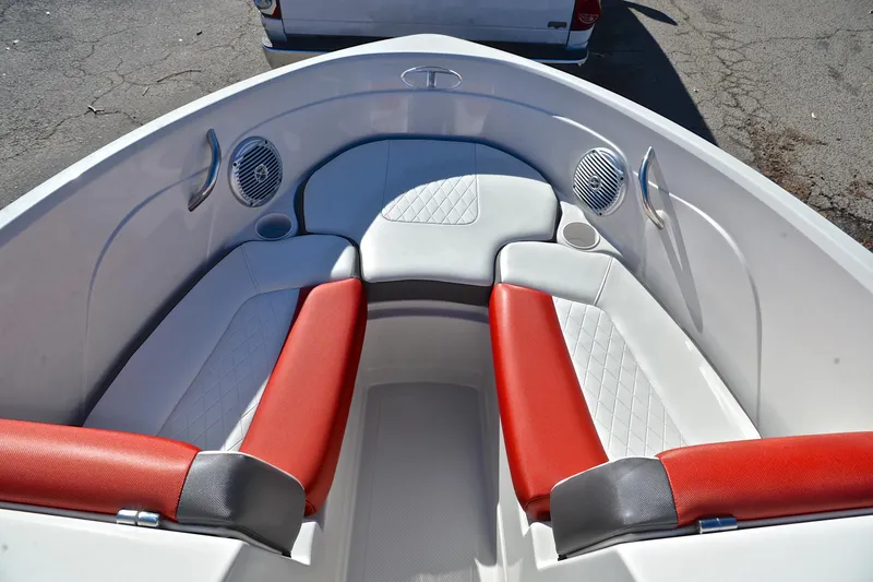 Slide: The Image of Interior of 2016 Tahoe 550 TS boat with red and white seating. - 21