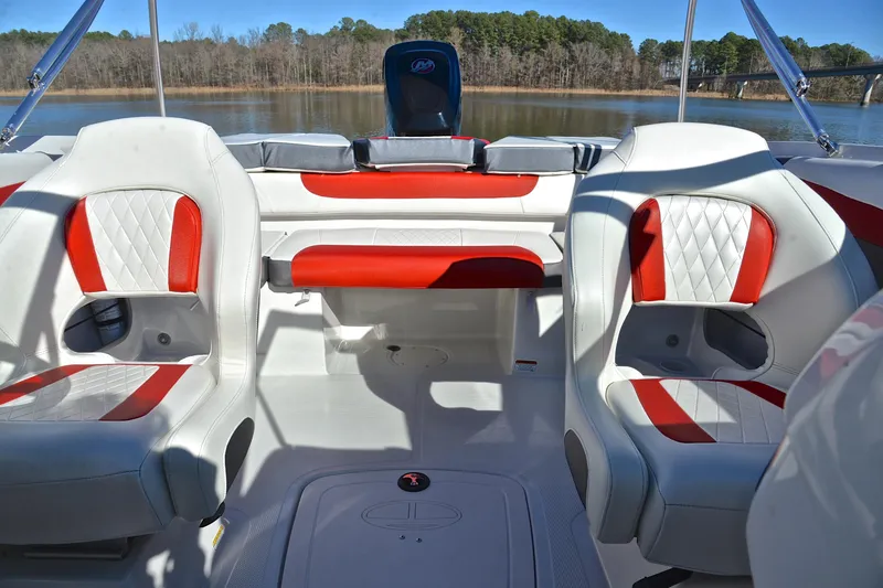 Slide: The Image of Interior of 2016 Tahoe 550 TS boat with red and white seating, lake view. - 22