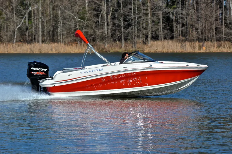 Slide: The Image of 2016 Tahoe 550 TS boat cruising on a lake with Mercury Pro XS engine. - 3