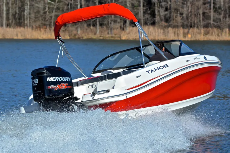 Slide: The Image of 2016 Tahoe 550 TS boat with Mercury engine on a lake, creating a splash. - 5