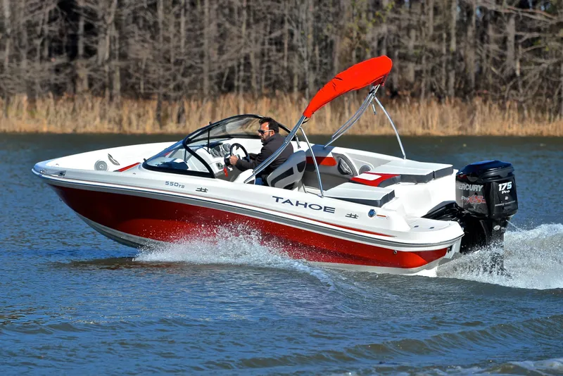 Slide: The Image of 2016 Tahoe 550 TS speedboat cruising on a lake with a Mercury 175 Pro XS engine. - 6