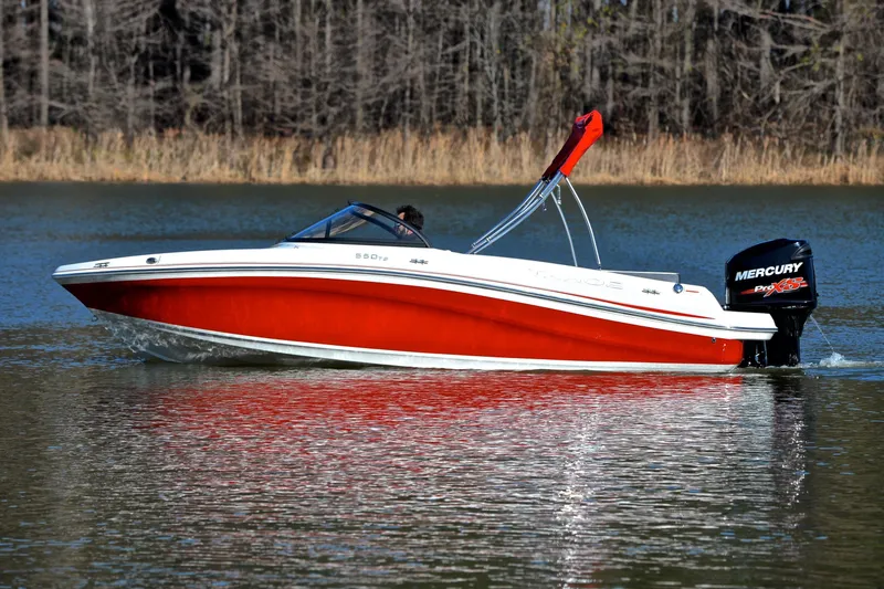 Slide: The Image of 2016 Tahoe 550 TS boat with Mercury engine cruising on a lake. - 9