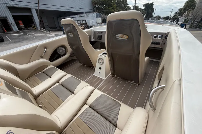 Slide: The Image of Interior of 2000 Spectre 30 Cat boat with beige and gray seating. - 8