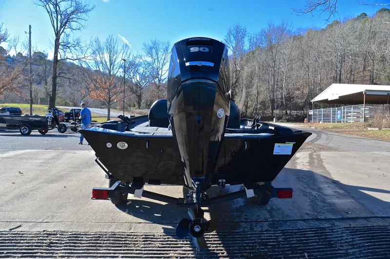 Slide: The Image of 2021 Lowe Legacy boat with Mercury 50 engine on a trailer, outdoors. - 11