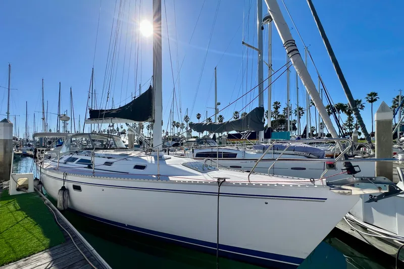 The Image of Sailboat Catalina 400, 1996 model, docked in a sunny marina with clear blue skies. - 0