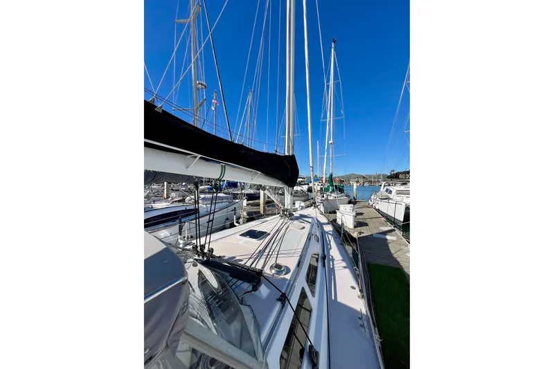 Slide: The Image of Catalina 400 sailboat from 1996 docked at a marina under clear blue skies. - 10