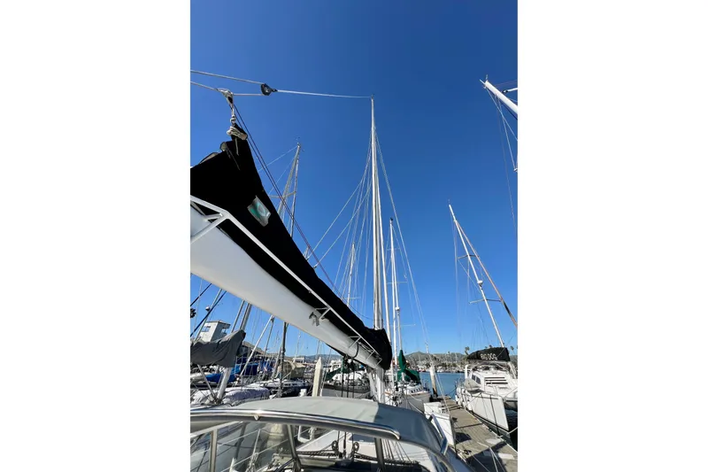 Slide: The Image of Sailboat mast view of 1996 Catalina 400 under clear blue sky at marina. - 13