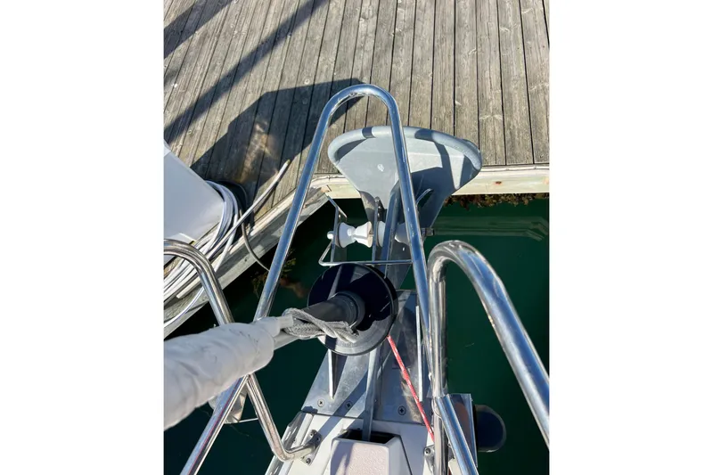 Slide: The Image of Bow of 1996 Catalina 400 sailboat docked at marina, showing anchor and railing. - 19