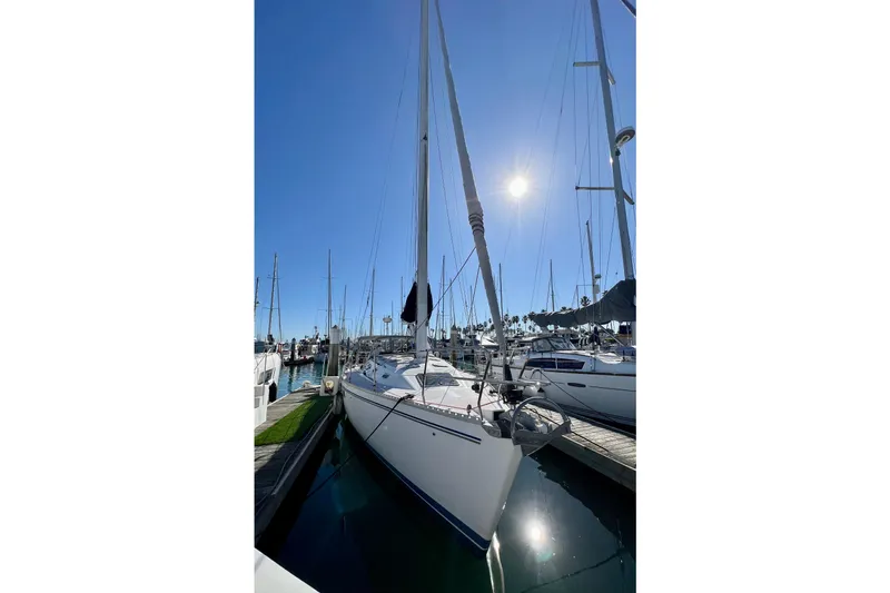 Slide: The Image of Sailboat Catalina 400, 1996 model, docked under clear blue sky. - 2