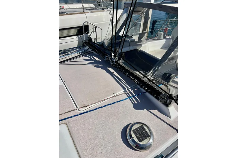 Slide: The Image of Deck of 1996 Catalina 400 sailboat with rigging and solar vent. - 25