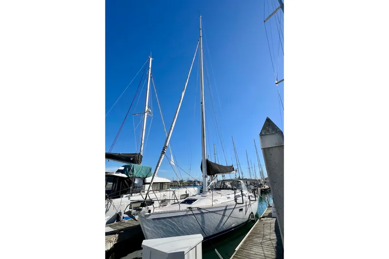 Slide: The Image of Sailboat Catalina 400, 1996 model, docked at marina under clear blue sky. - 3