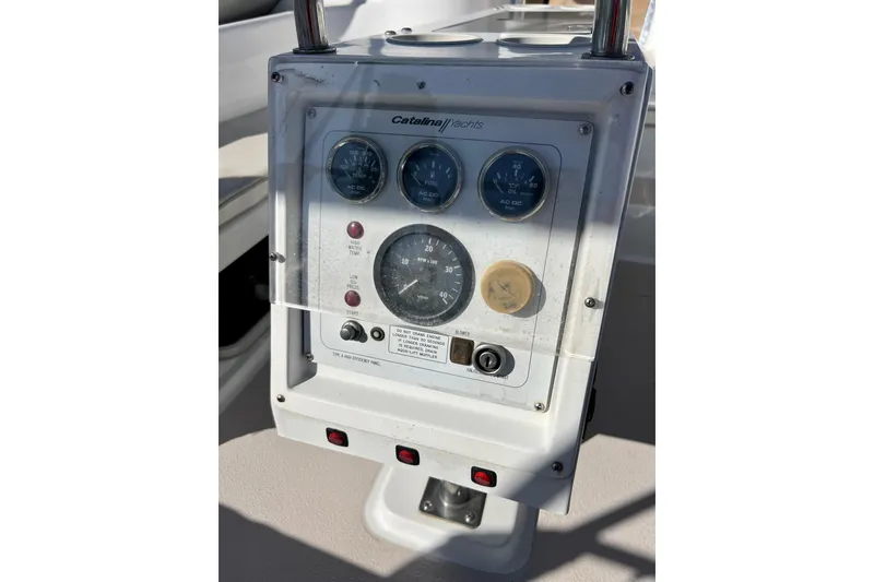 Slide: The Image of Control panel of a 1996 Catalina 400 yacht with gauges and switches. - 33