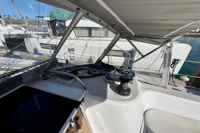 Slide: The Image of Cockpit view of a 1996 Catalina 400 sailboat docked at a marina. - 37