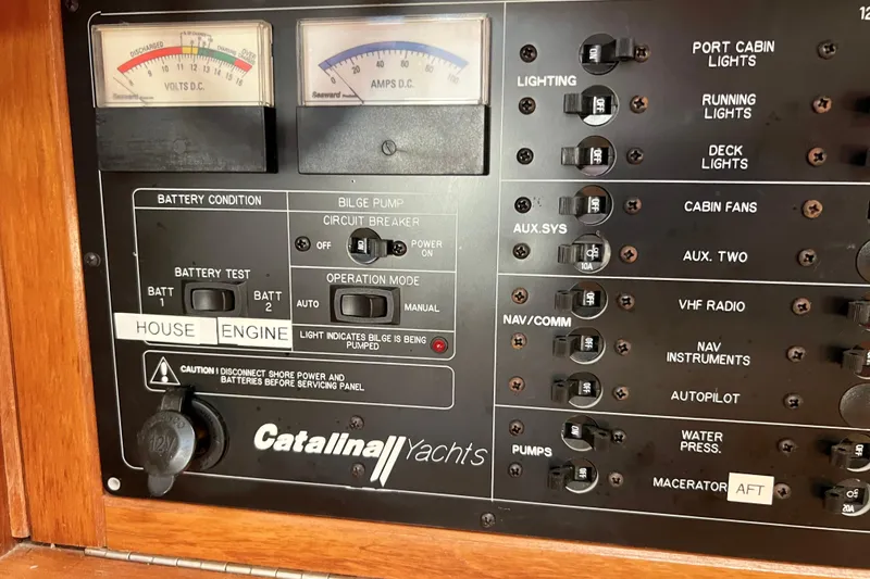 Slide: The Image of Control panel of a 1996 Catalina 400 yacht with battery and lighting switches. - 46