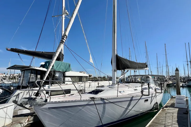 Slide: The Image of 1996 Catalina 400 sailboat docked in a marina under clear blue skies. - 5