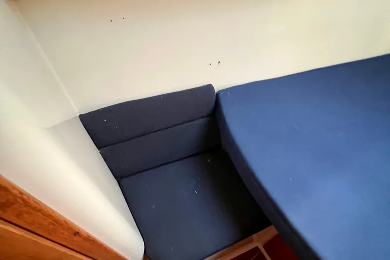 Slide: The Image of Interior cabin seating of 1996 Catalina 400 sailboat with blue cushions. - 67